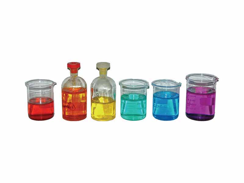 From left to right, aqueous solutions of: cobalt(II) nitrate, Co(NO3)2 (red); potassium dichromate, K2Cr2O7 (orange); potassium chromate, K2CrO4 (yellow); nickel(II) chloride, NiCl2 (green); copper(II) sulfate, CuSO4 (blue); potassium permanganate, KMnO4 (purple).