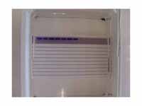 Agarose gel with samples loaded in th...